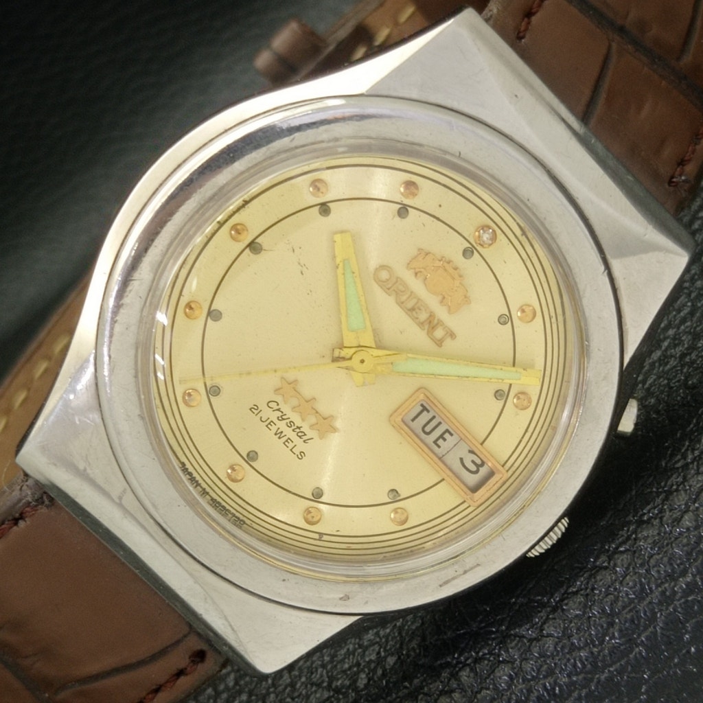 Vintage 1986 Orient Automatic Mens Silver Watch WDaydate  Gold Accents